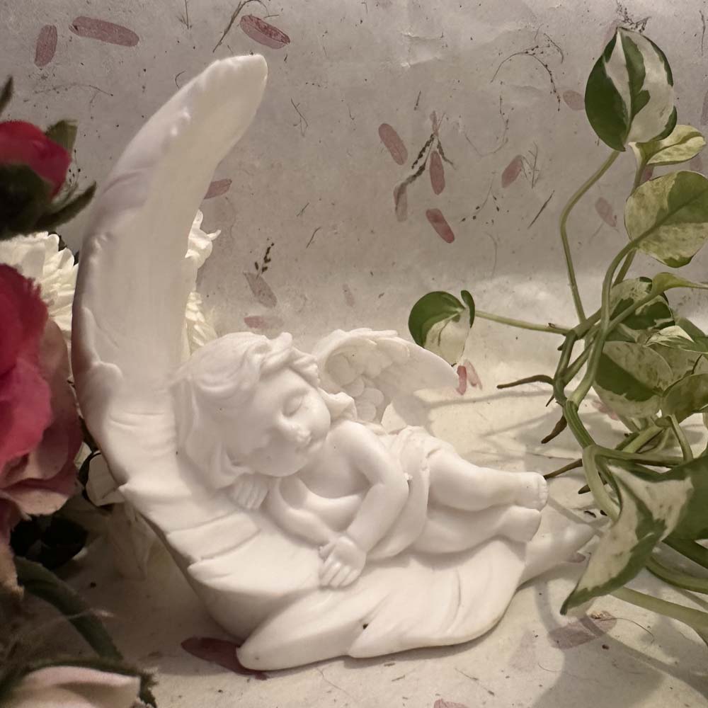 Angel Resting On A Crescent