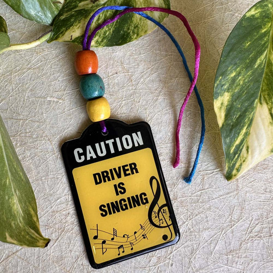 Car Hanging Caution Driver Is Singing